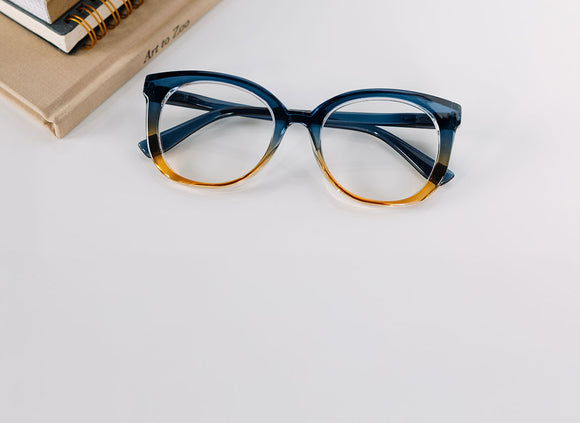 Blue and orange gradient eyeglasses on a light gray background