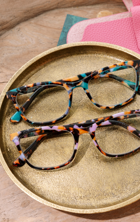 model wearing multi colored reading glasses