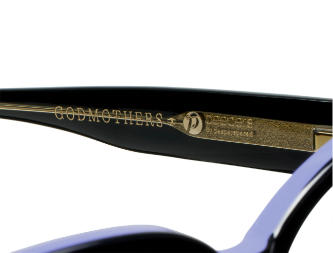 Black eyeglasses showing refined hardware and spring hinge detail