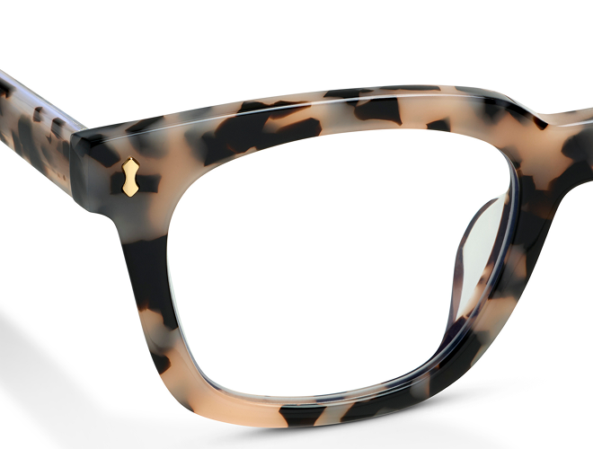 Close-up of eyeglass temple showing wire core detail and Peepers logo