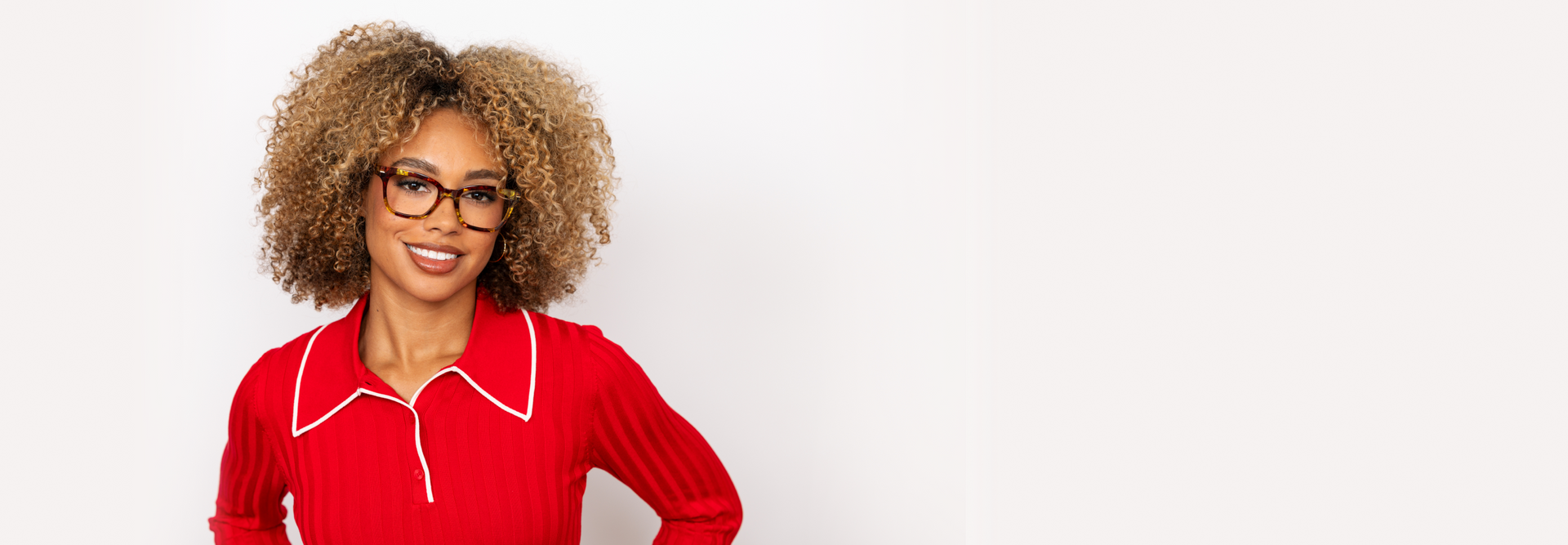 Main hero: Woman wearing a red blouse with a white background