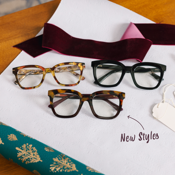 Three pairs of glasses on a white surface with 'New Styles' text.