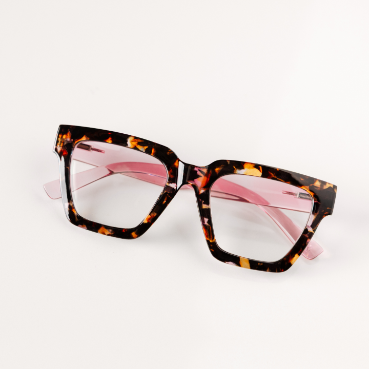 Tortoiseshell glasses with clearlenses on a white background