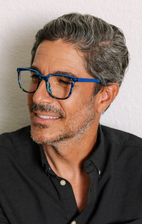 model wearing blue reading glasses