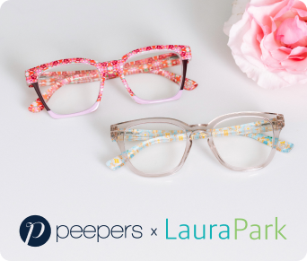 Two pairs of glasses with floral and clear frames on a white surface with a pink flower.