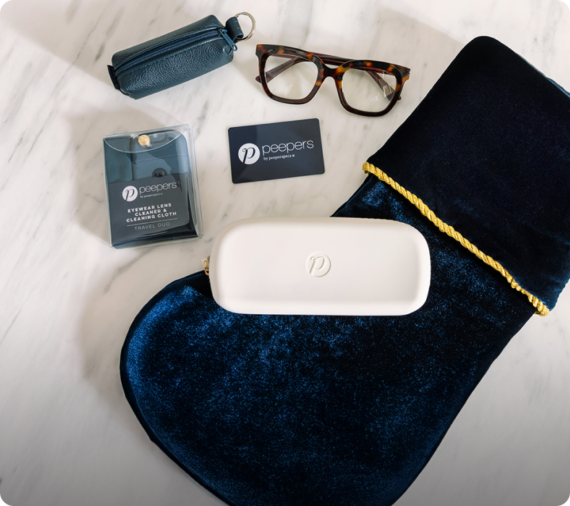 Eyeglasses, blue case, and white box on a white surface with 'peepers' branding.