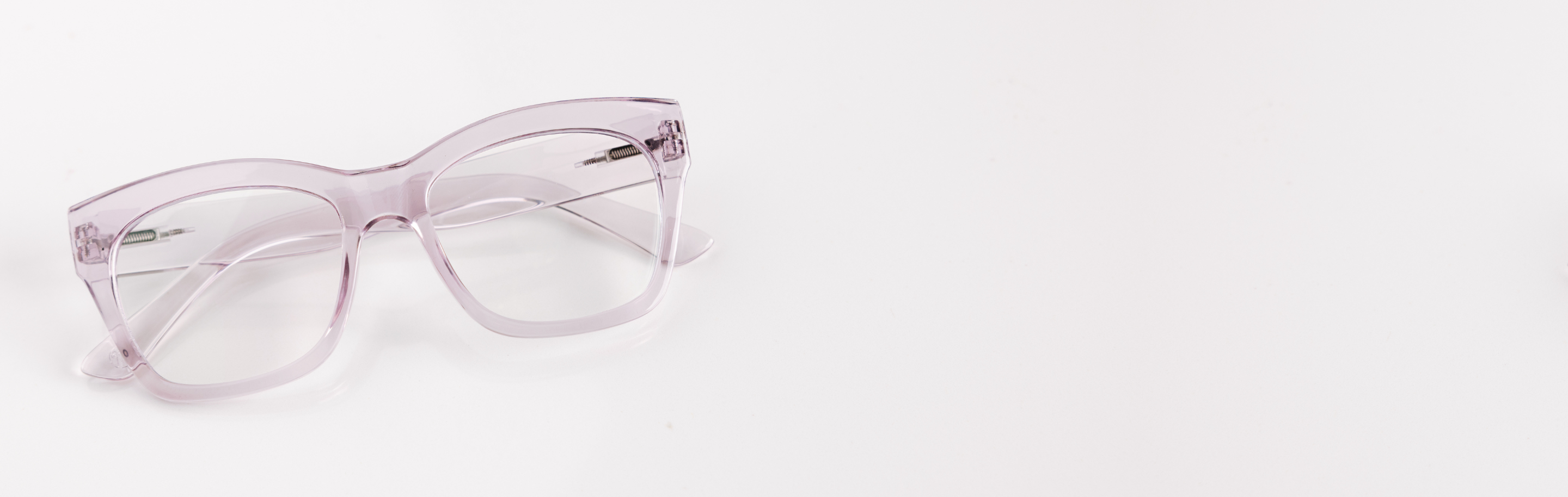Pink eyeglasses on a white background