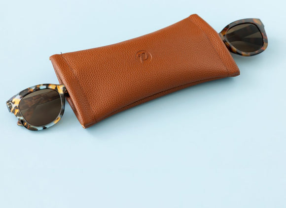 two sunglasses in the double squeezer with blue background
