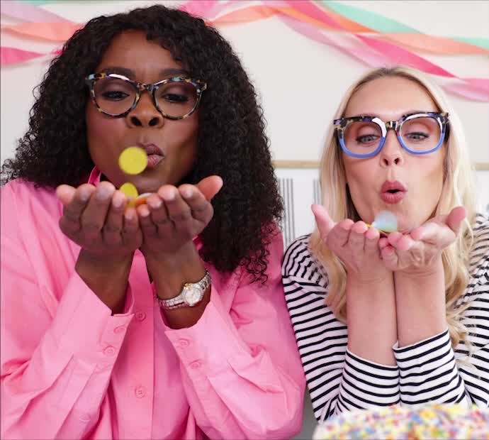2 Women Blowing Confetti