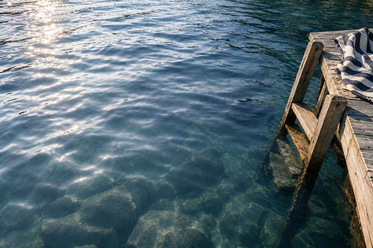 Illustration of bright reflected glare across a lake scene.