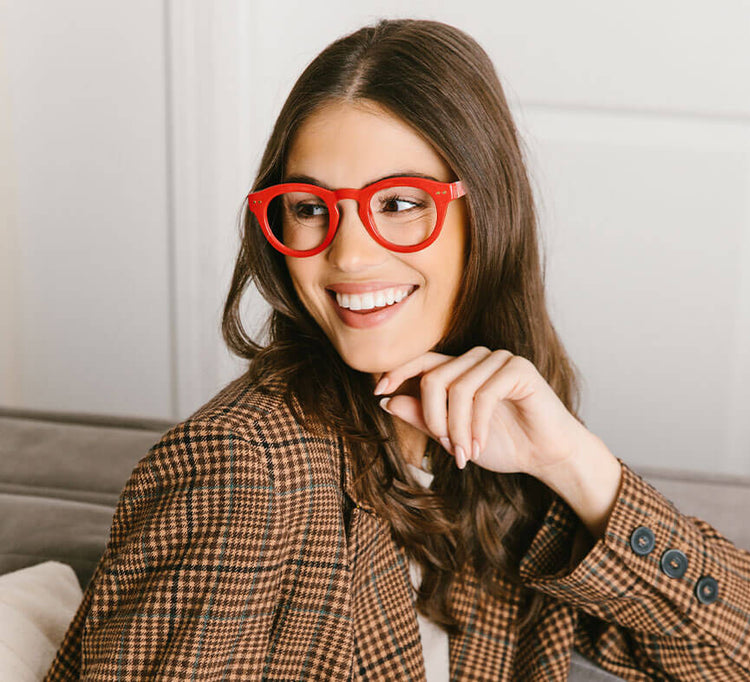 "The Lens" image representation. Female model smiling, wearing frames